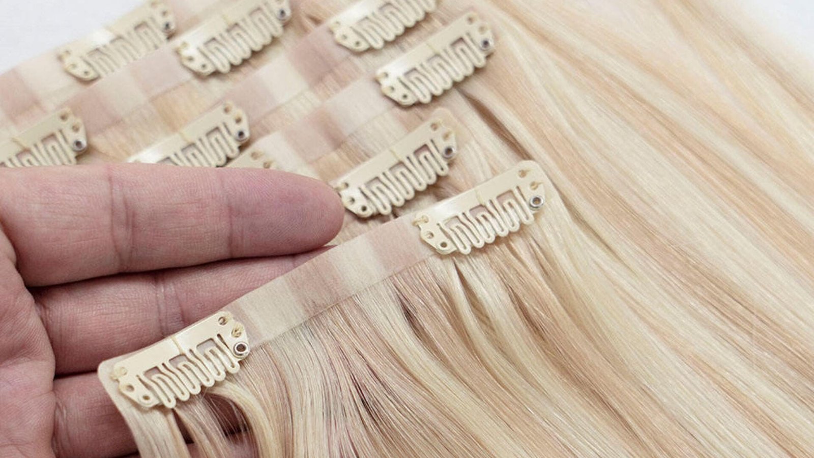 Clip-in hair extensions wholesale -- studio scene with real product