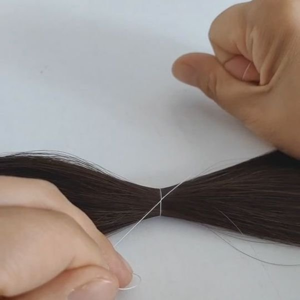 A microscope view showing the cuticle layer of a human hair strand